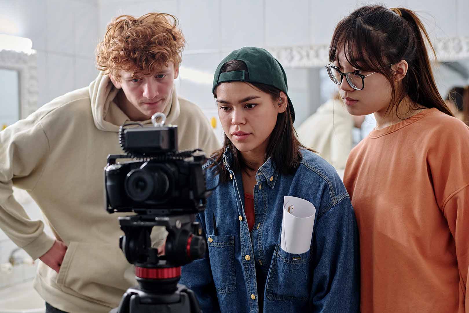 Interns collaborating on a video shoot