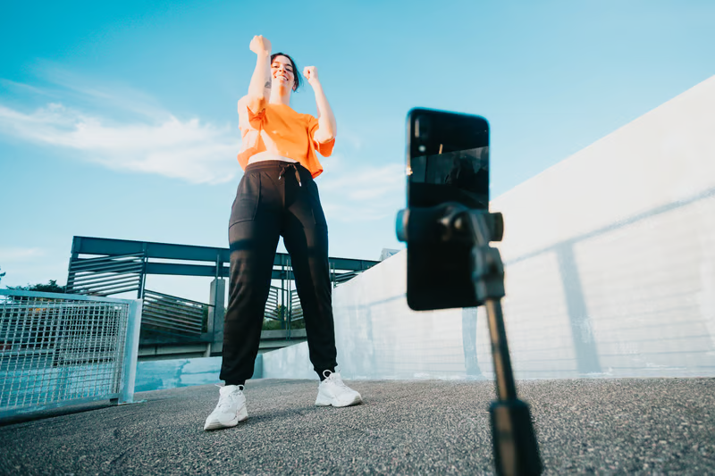 Person celebrating with phone